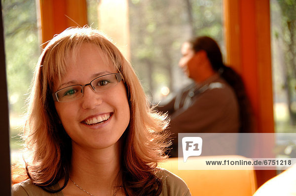 Close-up of Woman Man in Background