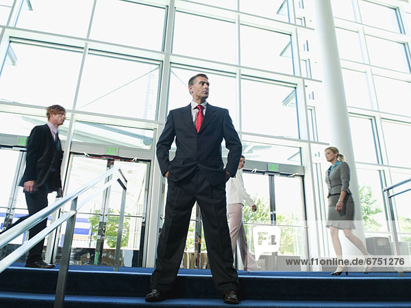 Confident businessman posing in lobby