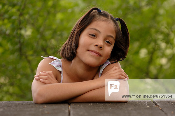 Young Girl Leaning on Wall