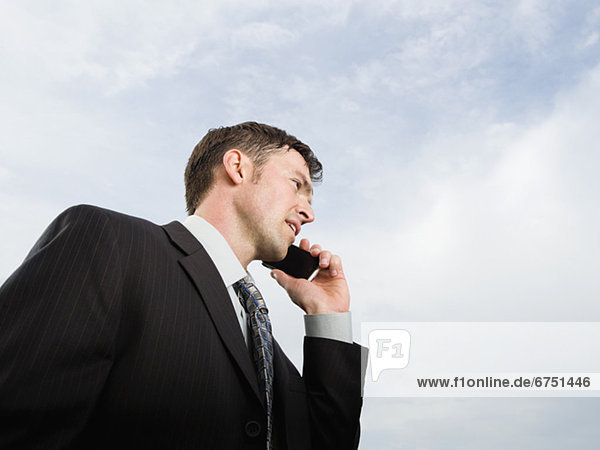 Close up of businessman talking on cell phone