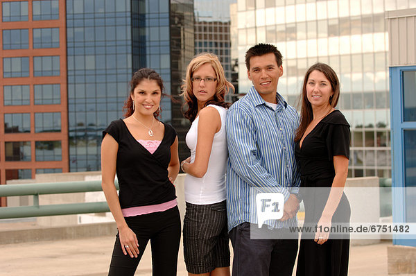 Group Outside with Cityscape in Background