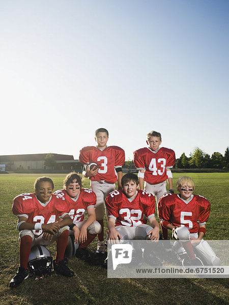 Portrait of youth football team on field
