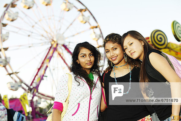 Teenage Girlfriends in Amusement Park
