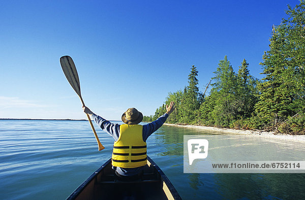 Canoeist on Little Limestone Lake  Northern Manitoba