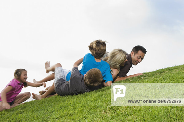 Family playing on grass