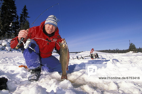 Ice Fisherman with Brook Trout  Northern Ontario