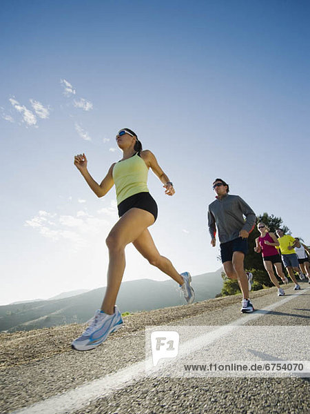 Runners on a road in Malibu