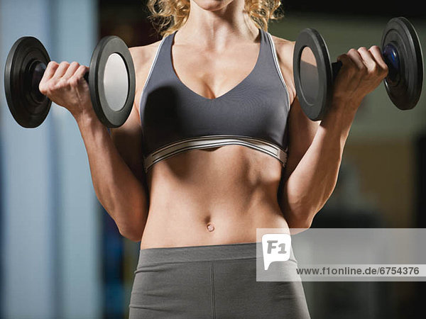 USA  California  Los Angeles  woman exercising with dumbbells