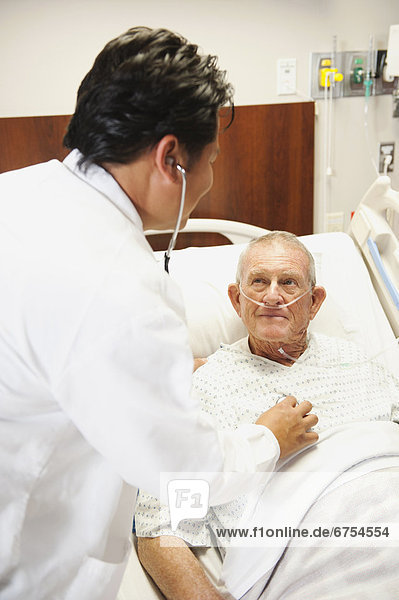 Senior patient with doctor