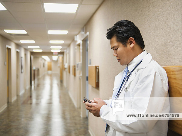 Portrait of doctor with mobile phone
