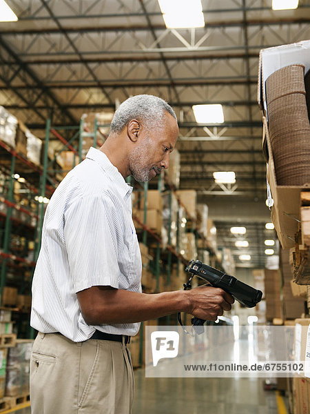 Warehouse worker scanning delivery