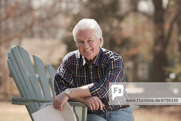 USA  Virginia  Richmond  portrait of senior man in adirondack chair