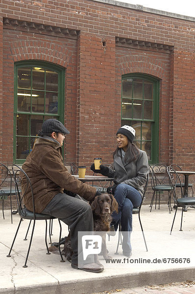 Couple at a Cafe with their Dog  Distillery District  Toronto  Ontario