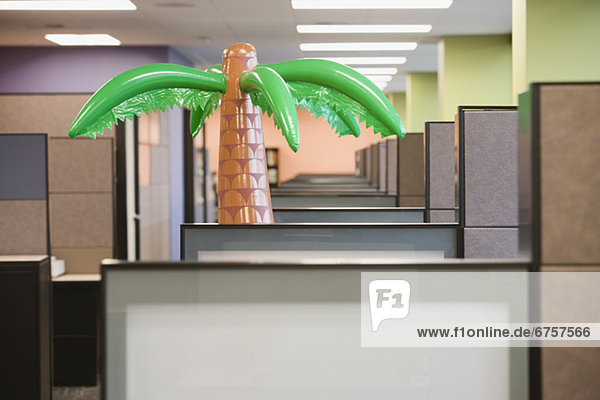 Inflatable palm tree in office