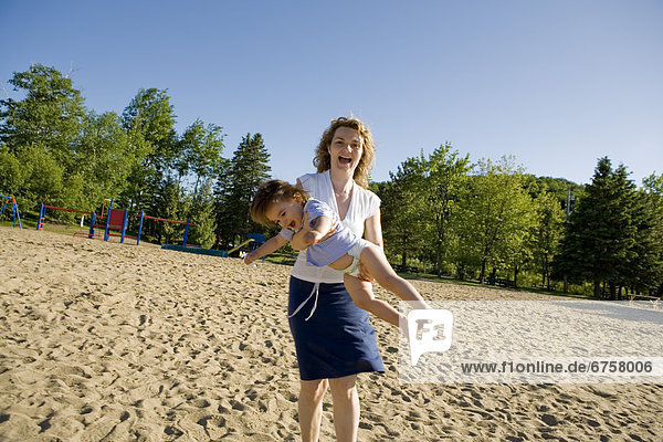Mom and Little Boy Playing on the Beach  Ste-Agathe  Quebec