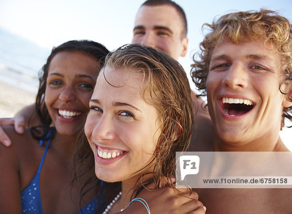 Young couples laughing on beach