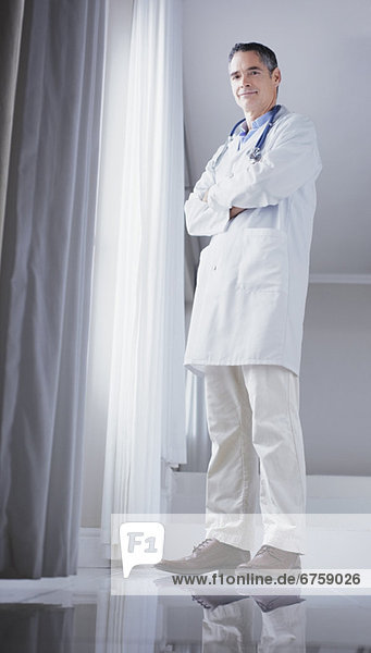 Doctor standing in front of window
