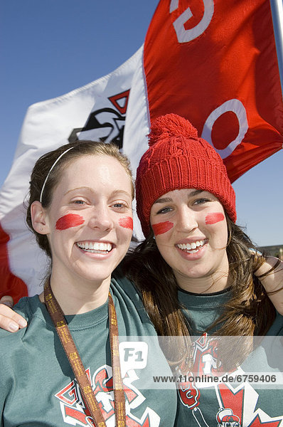 Female University Students during Homecoming Week with Face Painted and Flag  University of Manitoba  Winnipeg  Manitoba