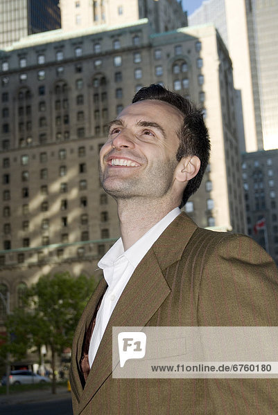 Businessman Smiling on City Street  Toronto  Ontario
