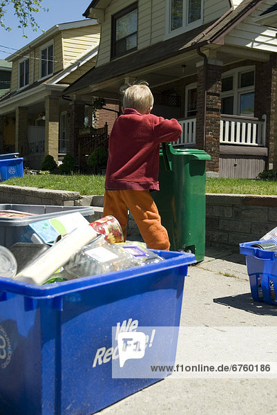 Little Boy Helping to take out the Recycling  Toronto  Ontario