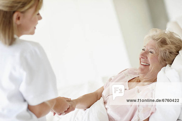 Nurse caring for a senior woman
