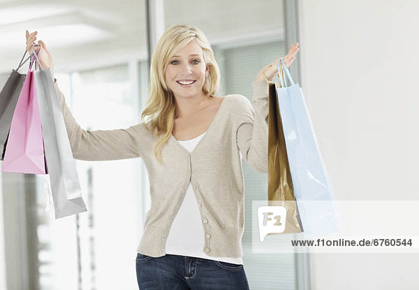 Attractive woman holding shopping bags