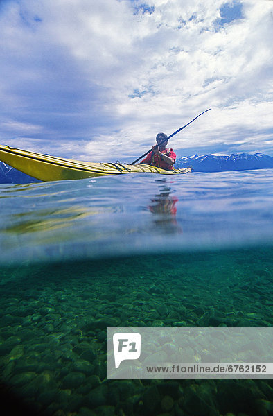 View of Kayaker in Shallow Water  Atlin Lake  Atlin  Northern British Columbia