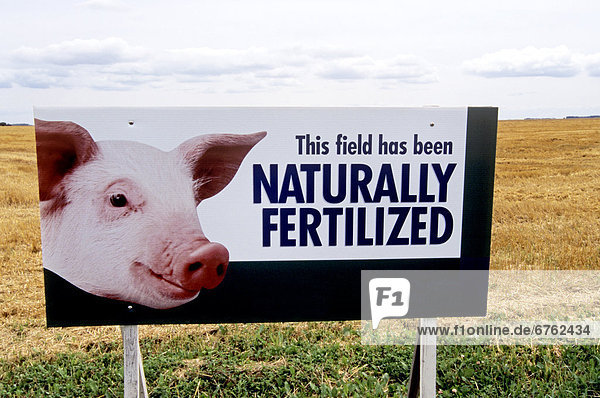 Sign at edge of a Harvested Grain Field  Winnipeg  Manitoba