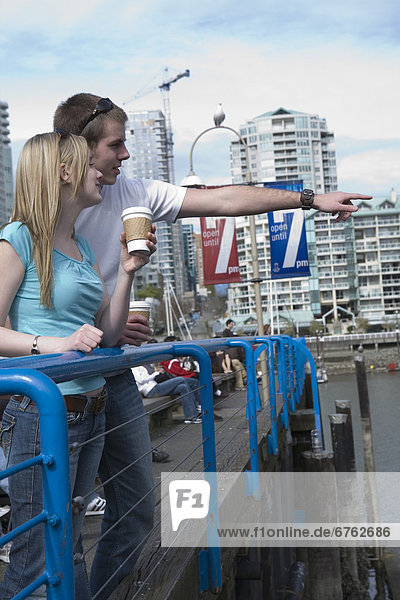 Couple on a Bridge looking out to Water  Granville Island  Vancouver  British Columbia