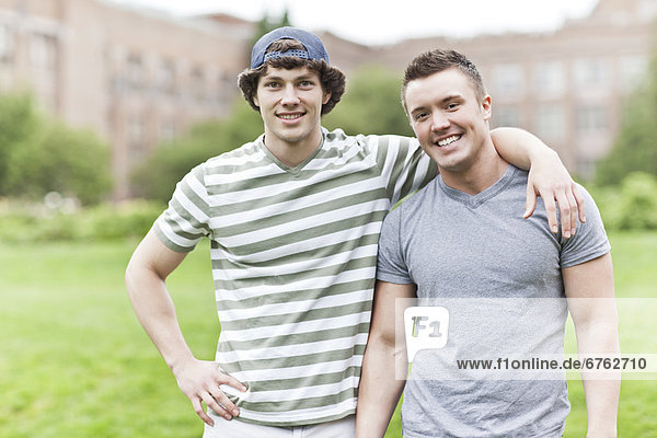 Portrait of two men on campus