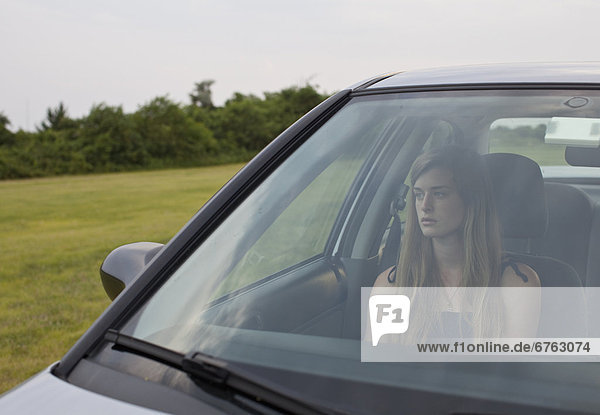 USA  New York State  Long Island  young woman sitting in car