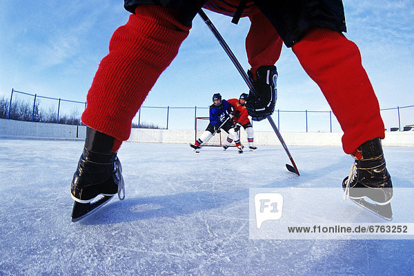 Teenage Boy and Girls Playing Hockey  Winnipeg  Manitoba