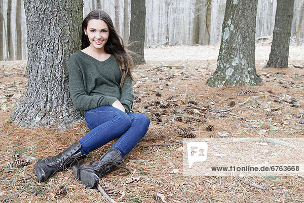 USA  New Jersey  Califon  Teenage girl (16-17) sitting in forest  portrait