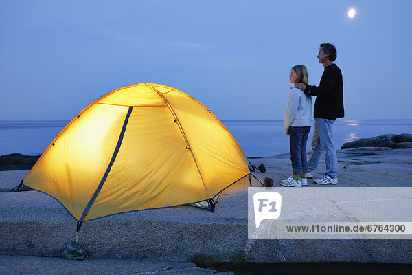 Father and Daughter beside Tent  St. Lawrence Marine Park  Les Bergeronnes  Quebec