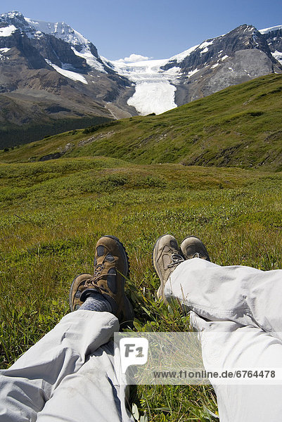 View of Hikers Legs Relaxing  Jasper National Park  Alberta