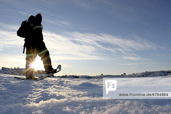 Cold trek across the frozen Back Bay portion of the Great Slave Lake  Yellowknife  Northwest Territories