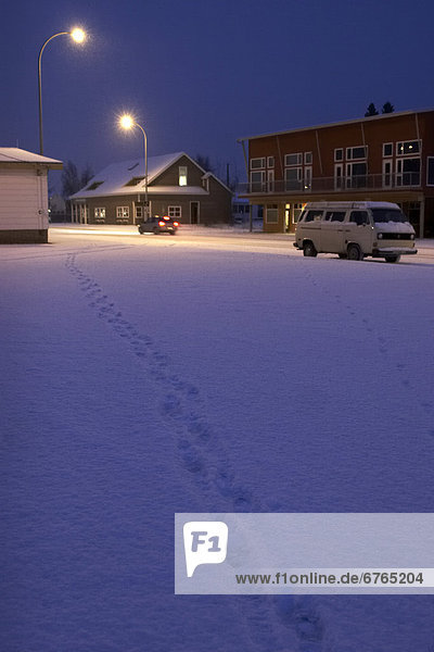 Footprints cutting across a parking lot  Whitehorse  Yukon