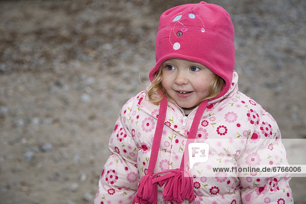 Small girl in pink hat  Lake Ontario  Ontario
