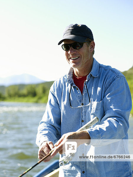 USA  Colorado  Mature man fly-fishing