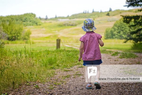Little Girl Walking Down Road  Cypress Hills Saskatchewan