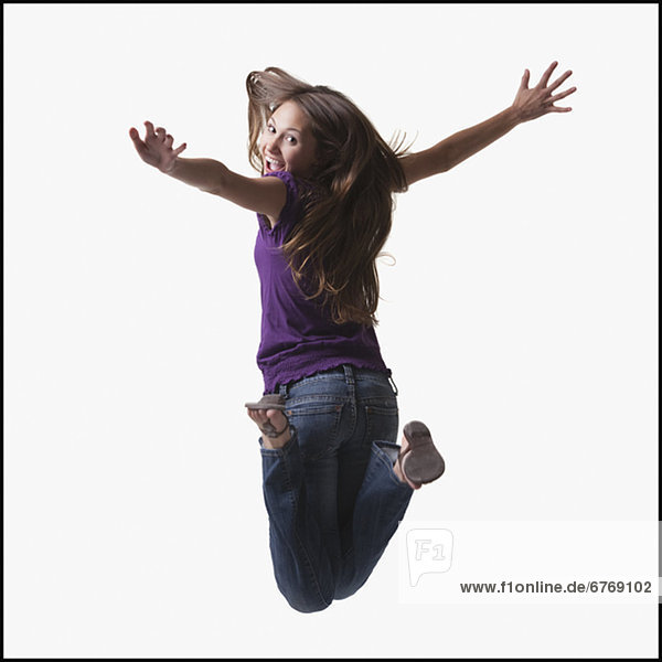 Teenage Girl jumping for joy