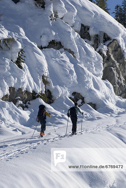 Skiers Heading up Cloudburst Mountain  Coast Mountains  British Columbia
