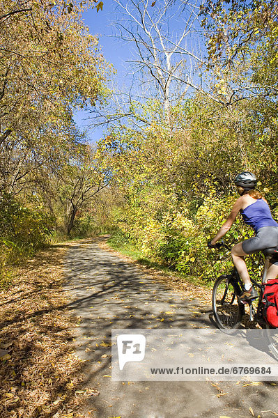 Women Riding Bicycle on Path  Toronto  Ontario