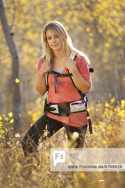 USA  Utah  portrait of young woman hiking in forest