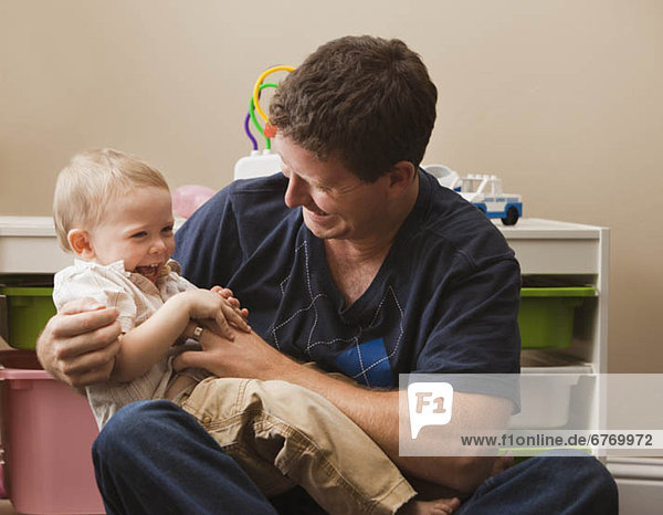 USA  Utah  father tickling son (18-23 months)