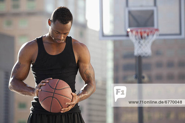 USA  Utah  Salt Lake City  basketball player holding basketball