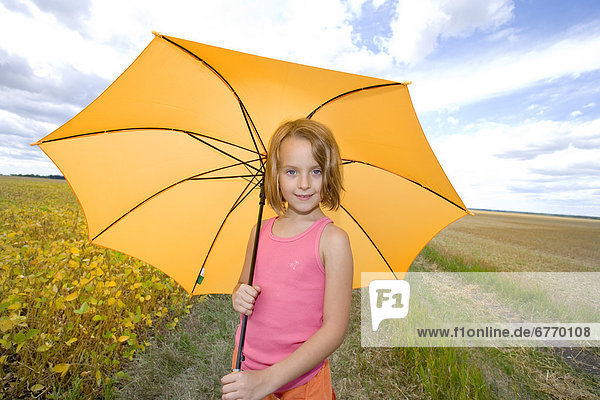 Girl with Umbrella in Field  Manitoba