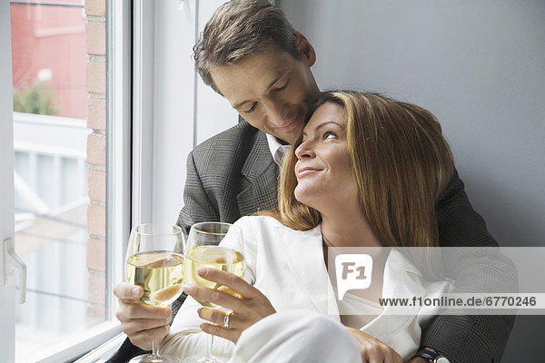 Couple Toasting with White Wine  Toronto  Ontario