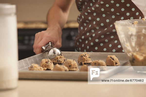 Woman preparing chocolate cookies
