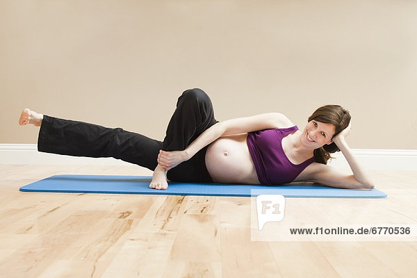 USA  Utah  Lehi  Young pregnant woman exercising